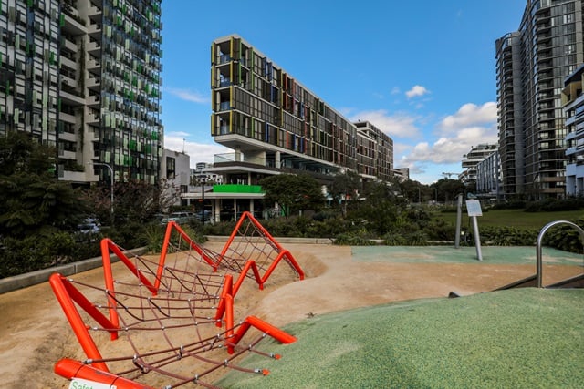 View of the bright red rope structure at The Rope Walk 2 Playground.