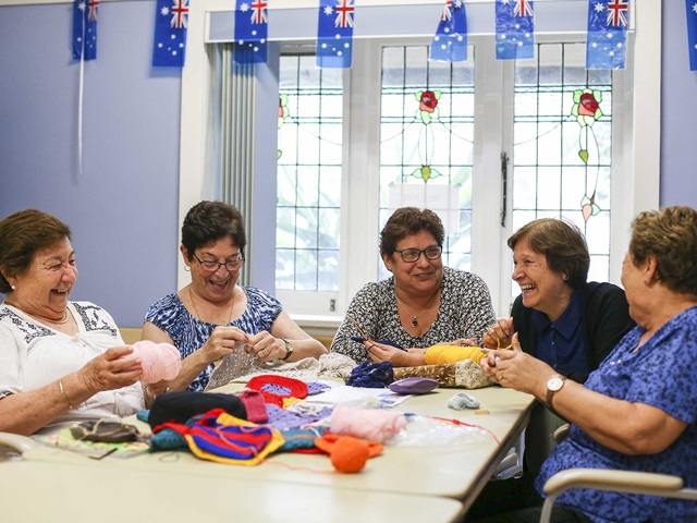 Members of the Beaconsfield Community Centre enjoying knitting and community activities