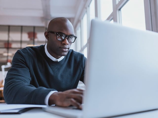 Young businessman working on his laptop